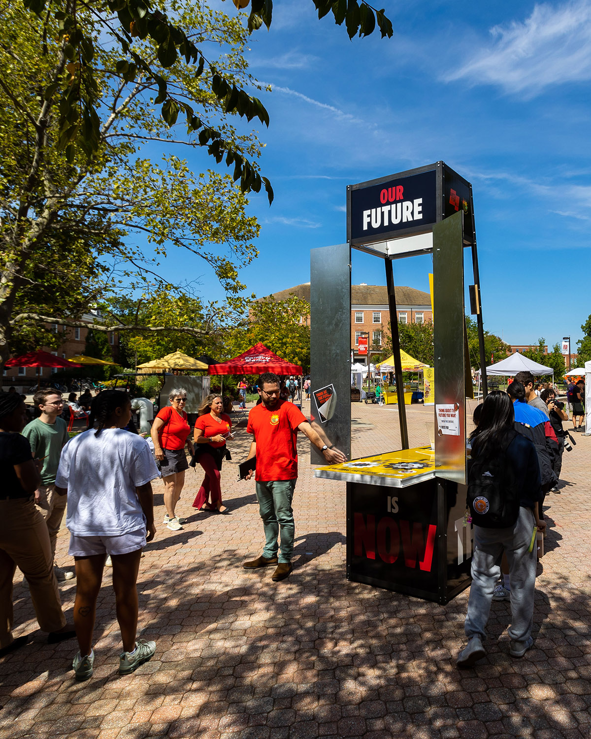 Faculty informing students about the TerpsVote booth