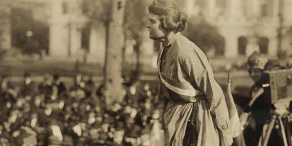 Woman addressing a crowd- old sepia photograph