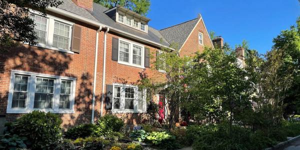 Brick housing with green trees