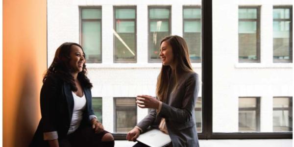 Girls talking on a window sill