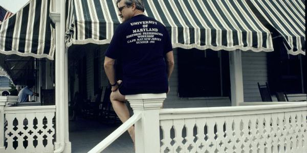 David Fogle sitting on the Chalafonte deck, his back to the camera