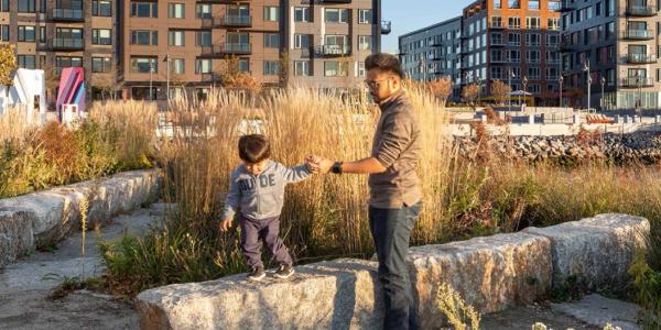 Father and child playing in a planned community