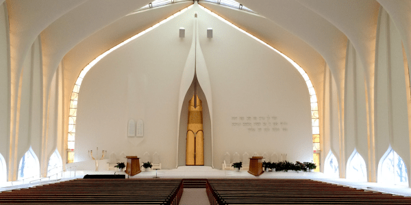 Interior of a synagogue with white curved walls