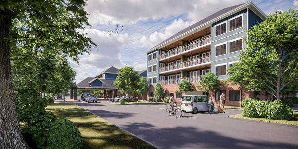 Residential community building with elderly people walking and biking. 