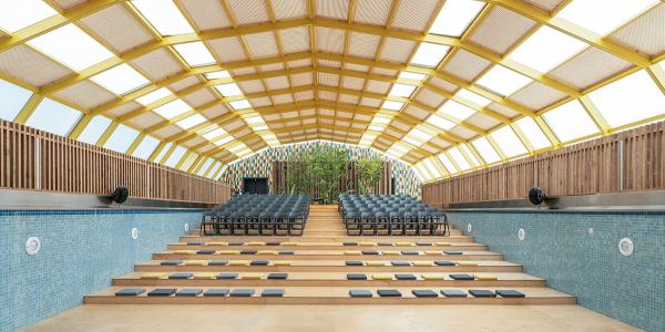 Auditorium seating inside a vacant pool