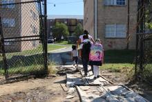 Back view of children with backpacks. 