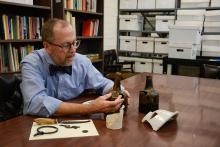 Interim Dean Donald Linebaugh working with artifacts from the Kippax Plantation Archaeological Site.