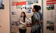 Students at Social Housing exhibit