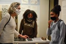 Larysa Kurylas and students talking in the Kibel Gallery, Holodomor exhibit