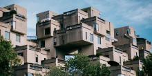 Cube designed buildings in greenery and bright blue sky