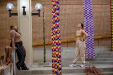 The women looking up at fabric hanging 