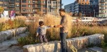 Father and child playing in a planned community