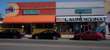 A street-side restaurant and laundromat 