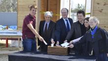 People putting paper in basket for WaterShed Ceremony