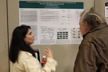 A student presenting her poster