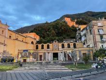 Historic buildings on a hill in Stabiae, Italy. Sunset colors are illuminating the facade.