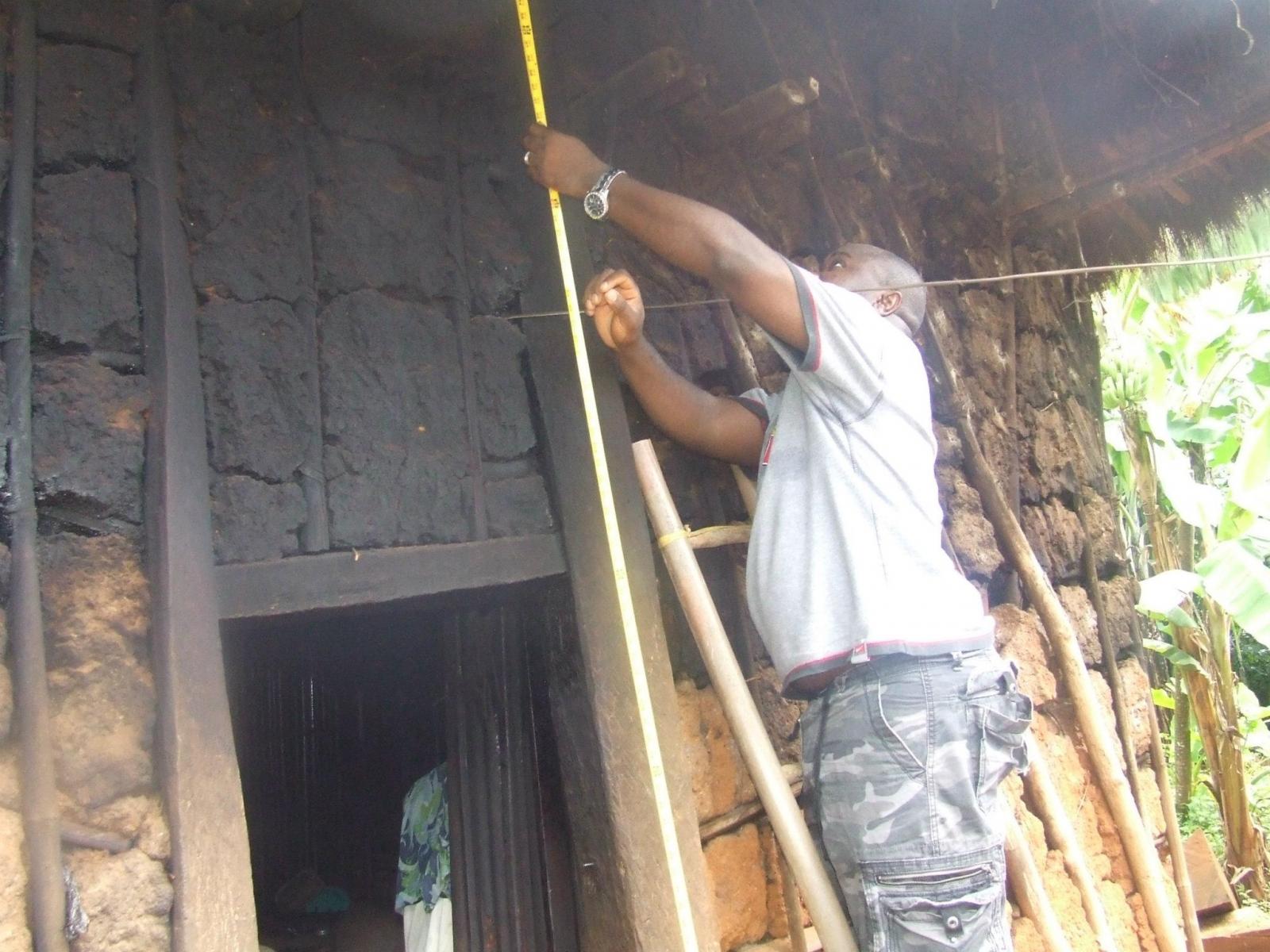 Gilbert conducting field work at a second generation Mbainwol house in 2010.