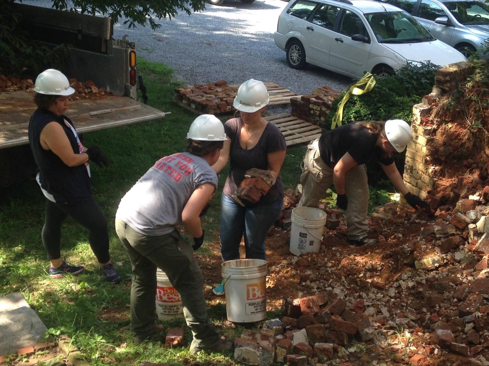 Students clean up debris from Bostwick's butress