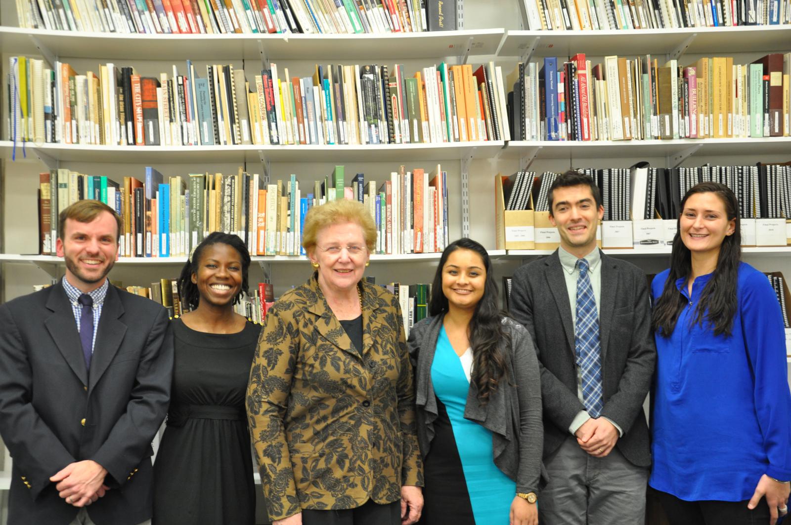 Connie Ramirez and students in front of books