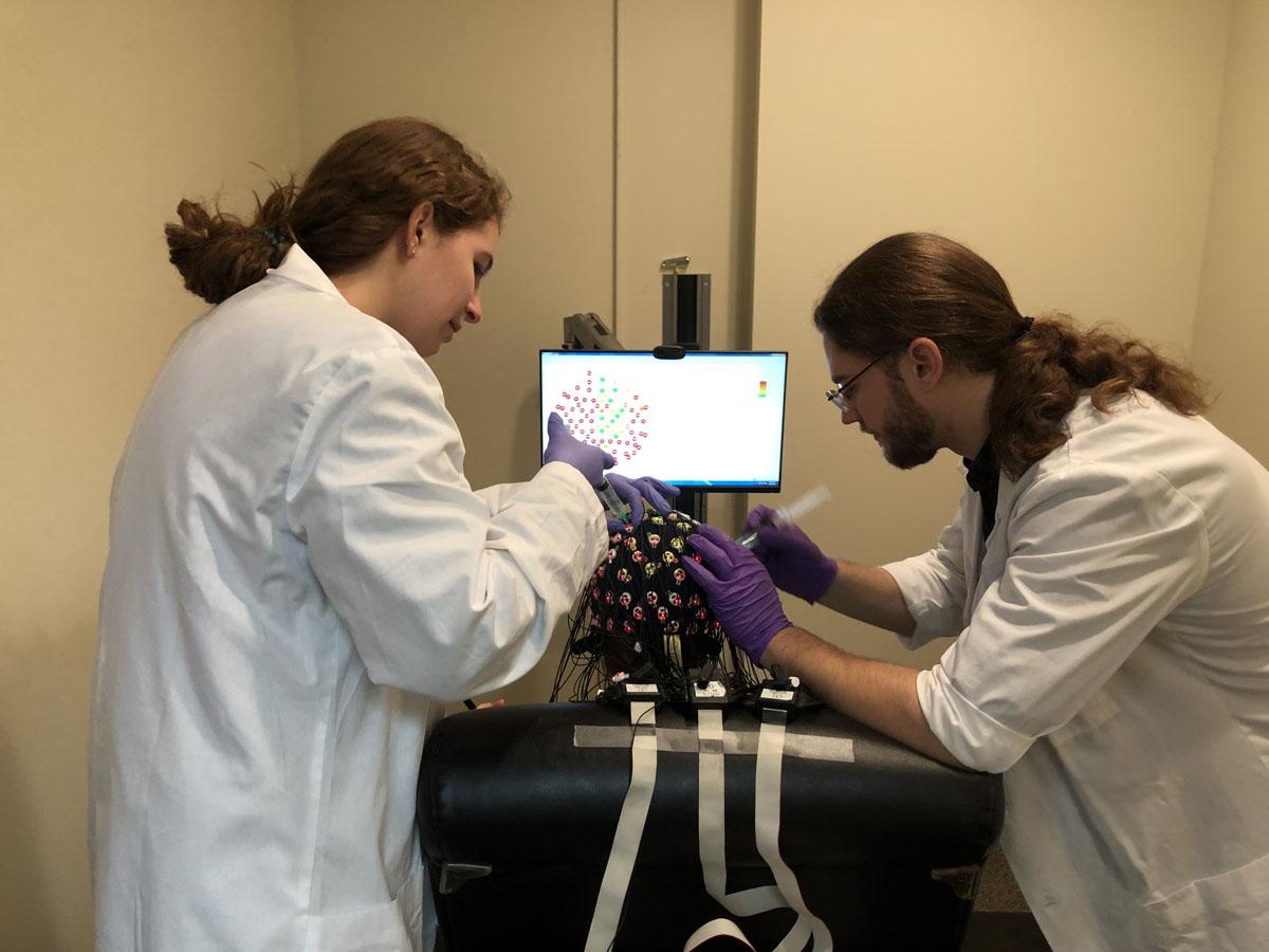 Setting up EEG cap on test subject.