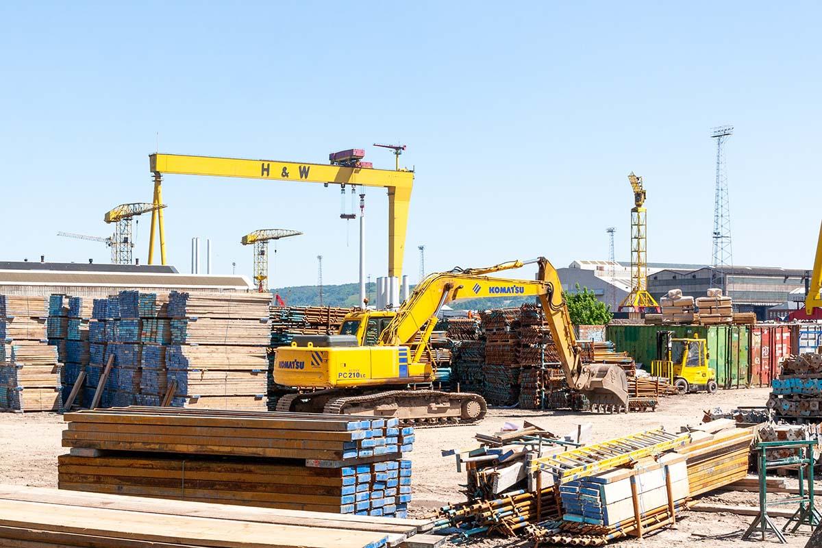 Construction site with cranes and building tools.