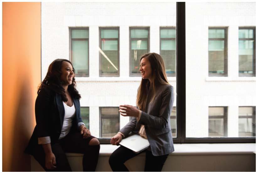 Girls talking on a window sill