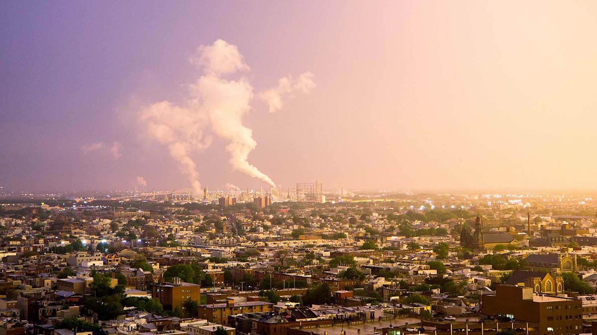 Oil refinery blowing smoke as the sun is setting in South Philly.