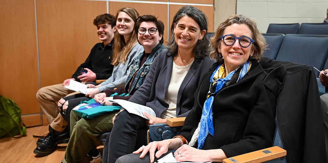 Panelists and students posing for the camera