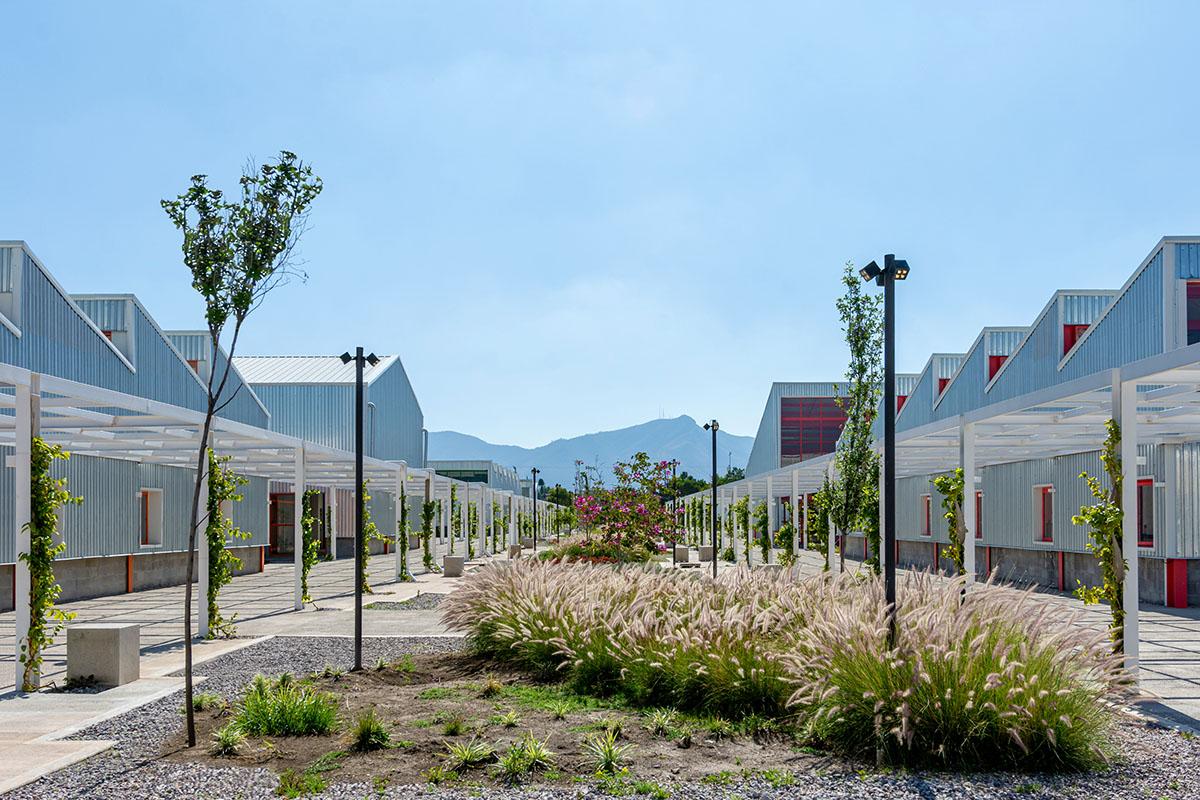 Library with a courtyard in the middle and mountains in the background.