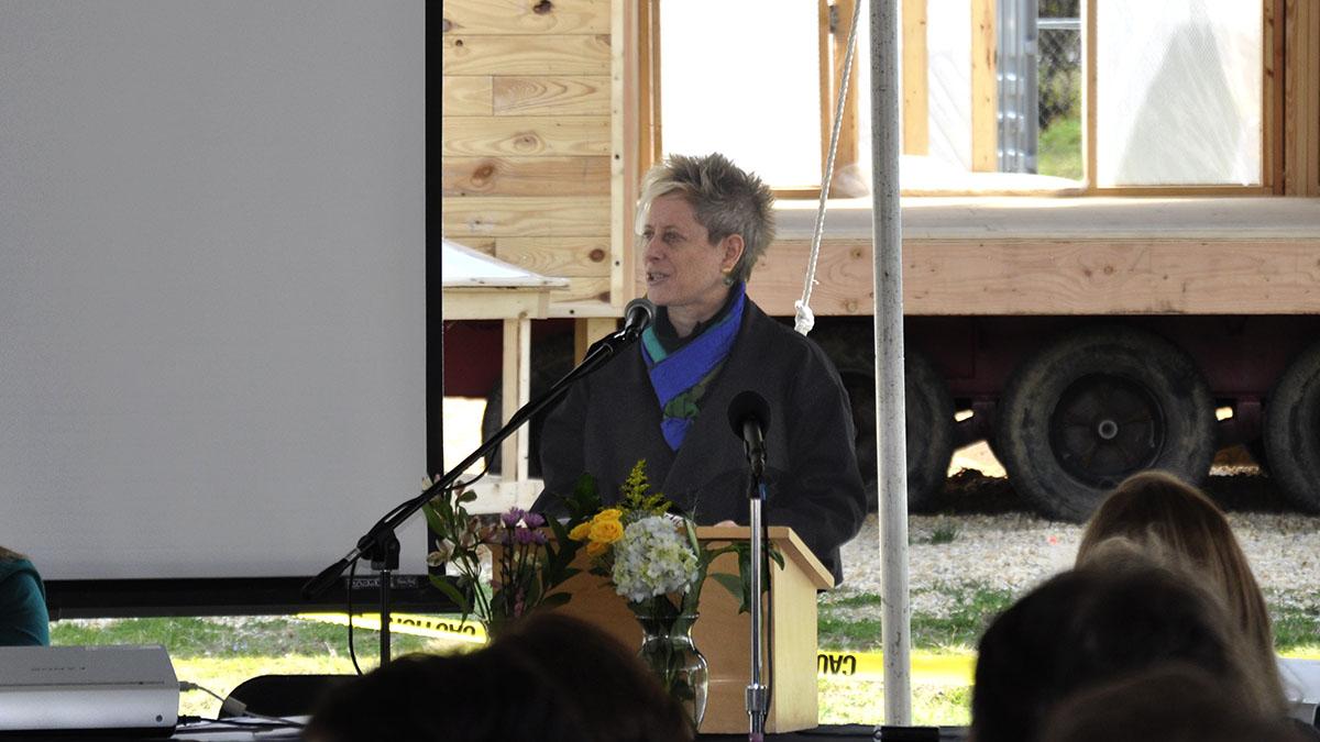 Woman speaking on stage