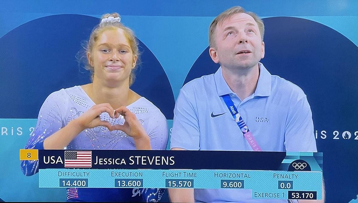 Olympic athlete and TERP alumn holding a heart hand gesture